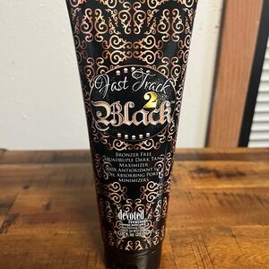 Luxurious Black and Gold Suncare Tanning Lotion